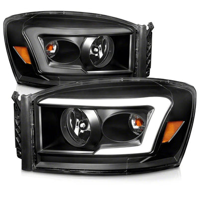 Raxiom 06-09 Dodge RAM 1500/2500/3500 Axial Series LED DRL Projector Headlights- Black- Clear Lens