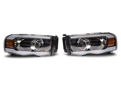 Raxiom 02-05 Dodge RAM 1500/2500/3500 Axial Series Proj Headlights/Seq LED Bar- Black- Clear Lens