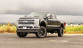 RLS - 4 Coil Spring Lift Kit with Falcon 1.1 Monotube Front Rear Shocks Radius Arms Dual Steering Stabilizer and Front Track Bar Bracket Fits Ford F250 F350 Diesel 2023-2024