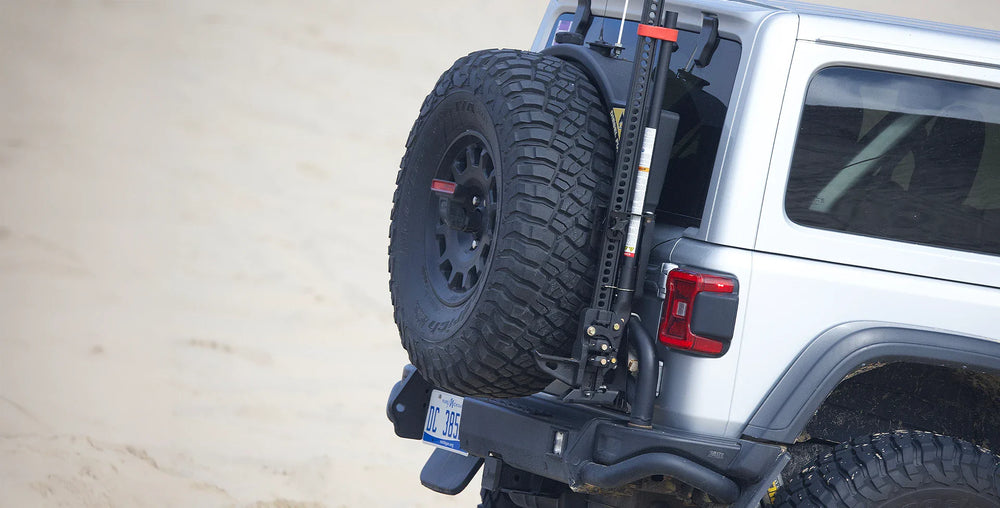 AEV 2018-25 JL Wrangler This rugged bolt-on mount is engineered to install quickly fit tight and provide a solid vibration-free storage solution for the popular Hi-Lift Jack Mount. AEV has carefully placed the Jeep Wrangler JL Hi-Lift Jack Mount direct