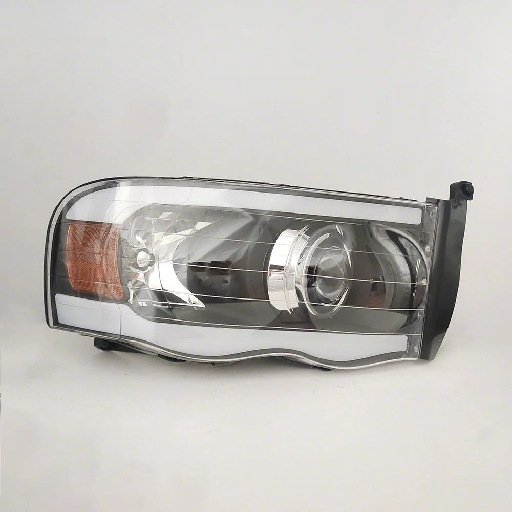Raxiom 02-05 Dodge RAM 1500/2500/3500 Axial Series Proj Hdlts/LED Bar- Black- Clear Lens